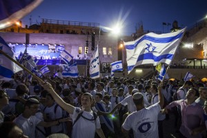 Jewish boys wave Israeli flags near the Western Wall in the Old City of Jerusalem as part of celebrations for Jerusalem Day, June 5, 2016. The holiday marks the day when Jerusalem was reunified as part of Israel as a result of the Six-Day-War in 1967. Photo by Zack Wajsgras/Flash90 *** Local Caption *** יום ירושלים מצעד הדגלים ריקודגלים הכותל הערבי העיר העתיקה
