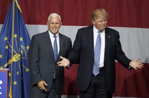 Presumptive US Republican presidential candidate Donald Trump (R) and Indiana Governor Mike Pence (L) take the stage during a campaign rally at Grant Park Event Center in Westfield, Indiana, on July 12, 2016.  / AFP / Tasos KATOPODIS        (Photo credit should read TASOS KATOPODIS/AFP/Getty Images)